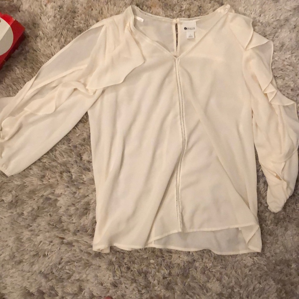 Cream blouse with arm slurs and ruffles